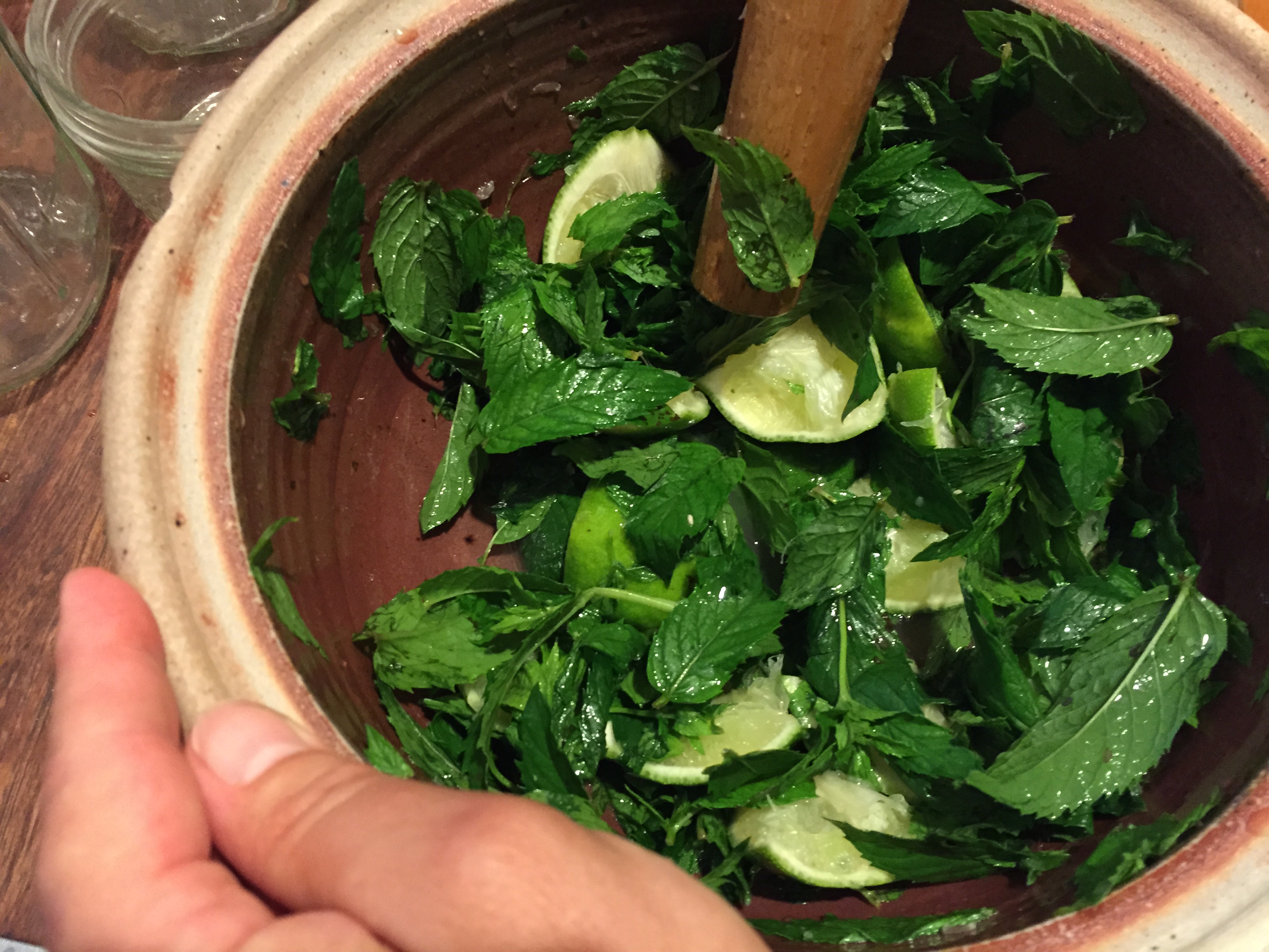 Rebecca preparing the mint and lime for a favorite fall afternoon preparation: mojitos!